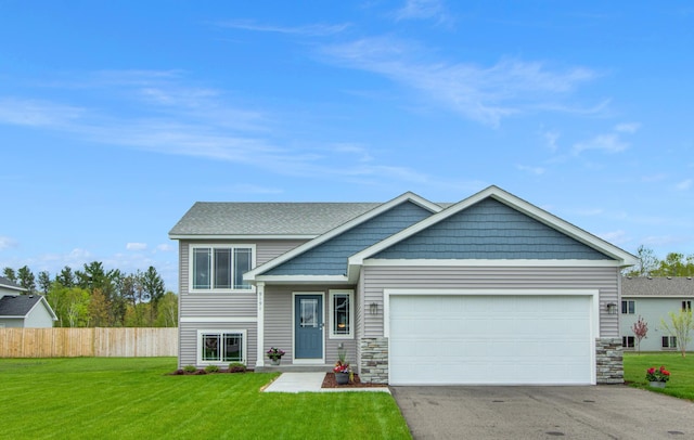 view of front facade with a garage and a front lawn