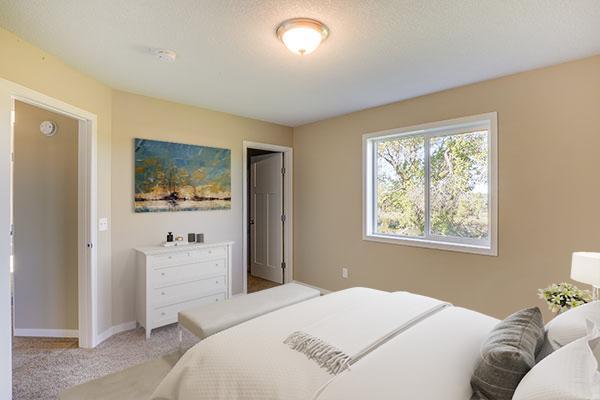 carpeted bedroom with a textured ceiling