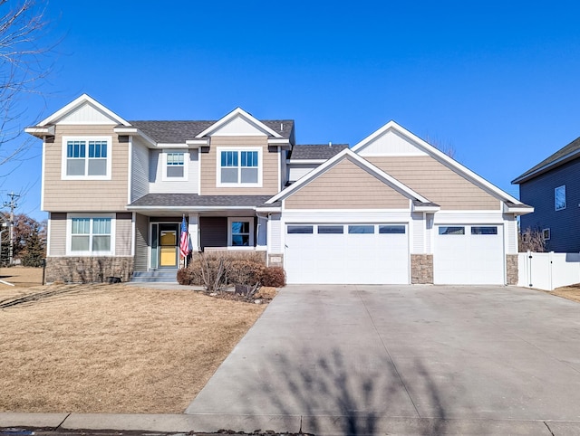 craftsman house featuring a porch and a garage