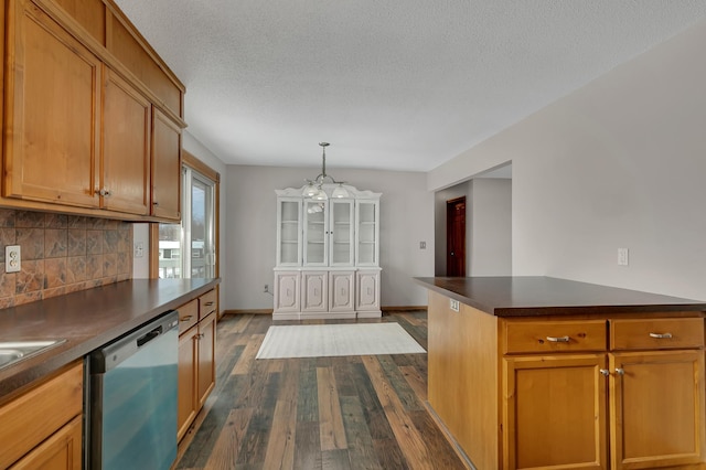 kitchen with dishwasher, dark hardwood / wood-style floors, a notable chandelier, a textured ceiling, and decorative light fixtures