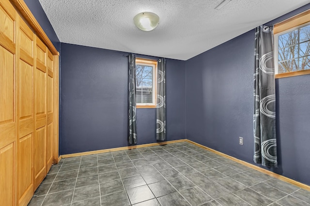 empty room with a textured ceiling