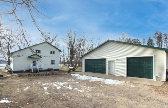 view of home's exterior with an outbuilding and a garage