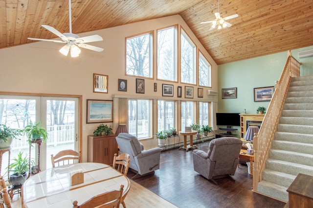 living room with dark hardwood / wood-style flooring, ceiling fan, high vaulted ceiling, wooden ceiling, and plenty of natural light