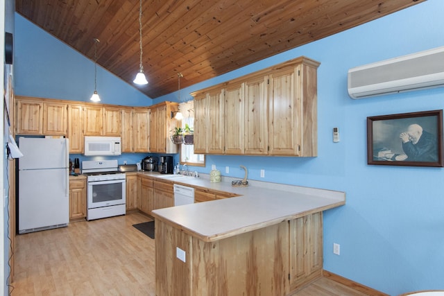 kitchen featuring pendant lighting, white appliances, an AC wall unit, light wood-type flooring, and kitchen peninsula