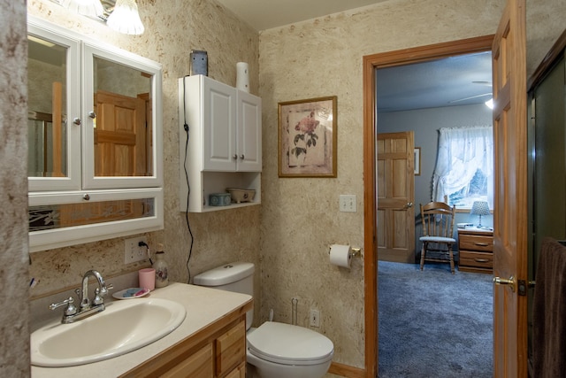 bathroom with vanity and toilet