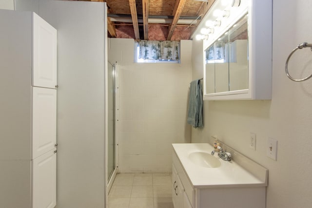 bathroom with vanity, plenty of natural light, and a shower with door