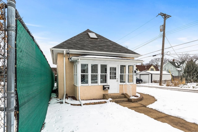 view of front of property with an outbuilding and a garage