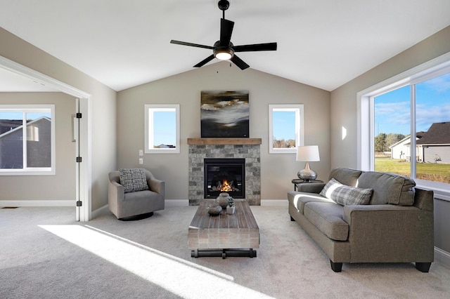 carpeted living room featuring a fireplace, ceiling fan, and lofted ceiling