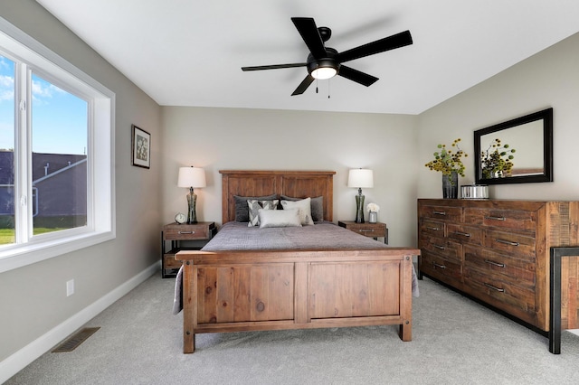 bedroom featuring ceiling fan and light carpet