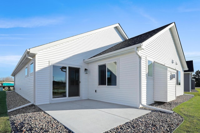 rear view of property featuring a patio area