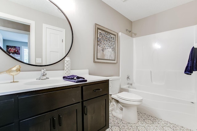 full bathroom featuring vanity, bathing tub / shower combination, tile patterned floors, toilet, and a textured ceiling