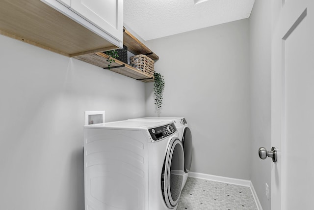 laundry area featuring cabinets and independent washer and dryer