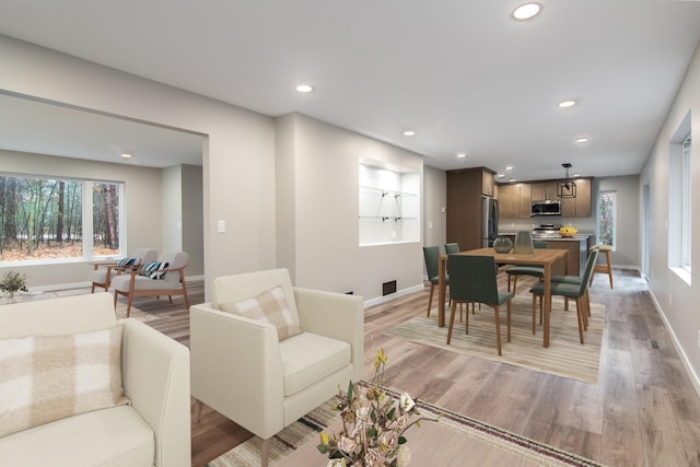 dining space with light wood-type flooring