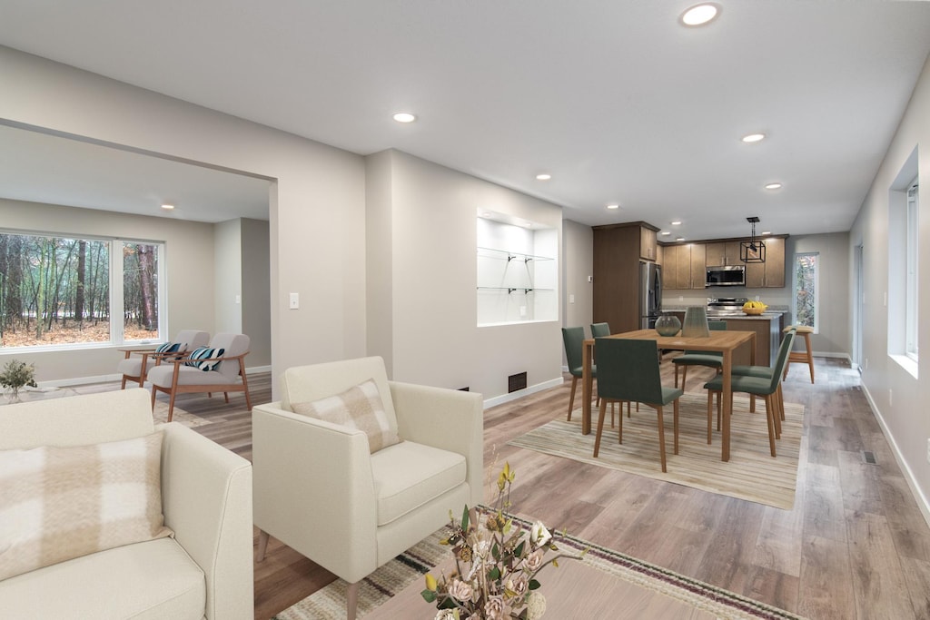 dining space featuring light hardwood / wood-style floors