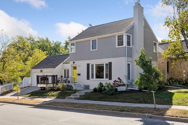 view of front facade featuring a garage and a front yard