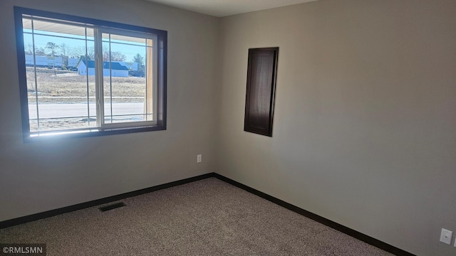 unfurnished room with carpet floors