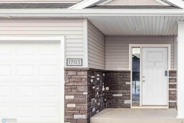 entrance to property featuring a garage