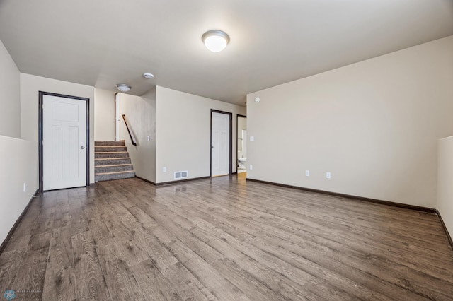 unfurnished living room with hardwood / wood-style floors