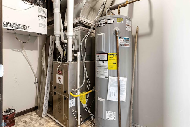 utility room featuring electric water heater