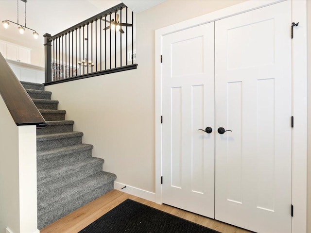 stairs with wood-type flooring