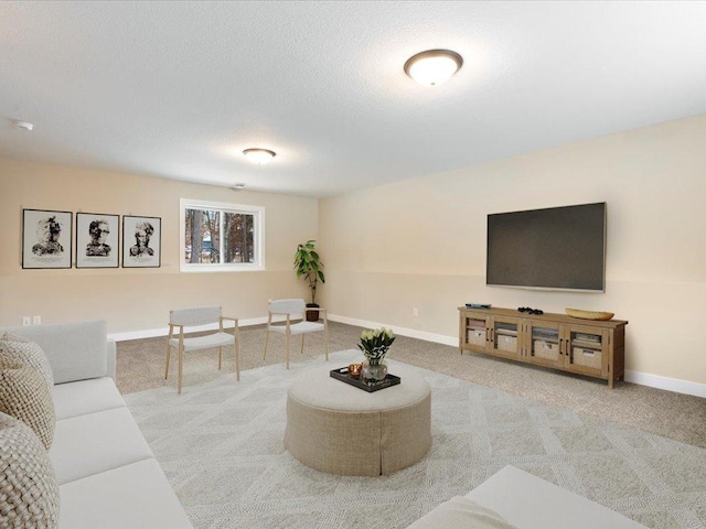 living area featuring carpet floors and baseboards