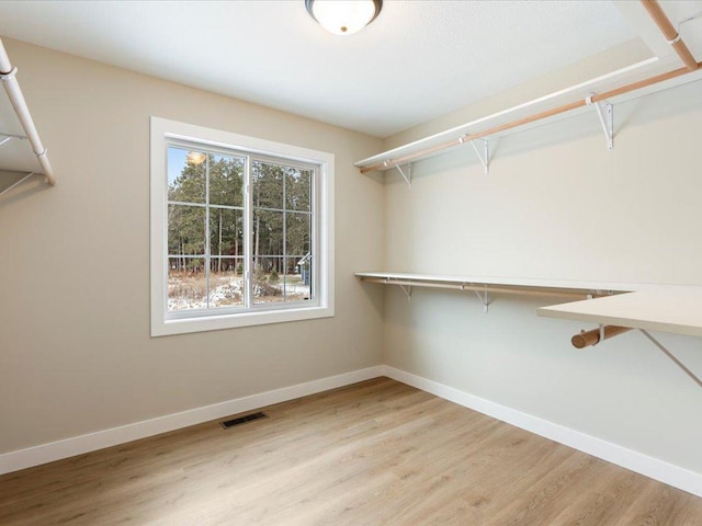 spacious closet with visible vents and light wood finished floors