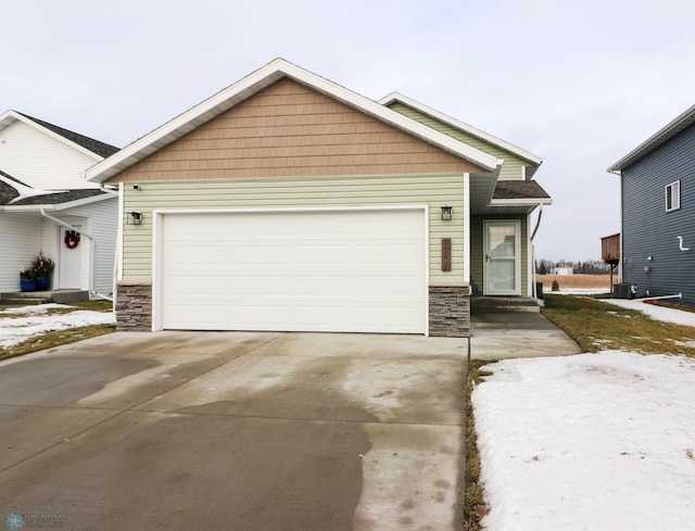 view of front of home featuring central AC and a garage