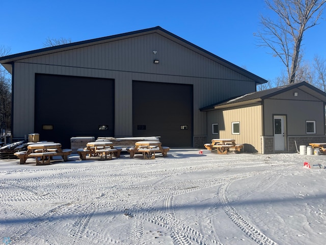 view of snow covered garage