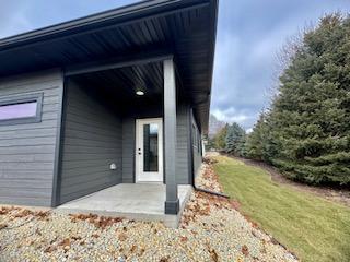 property entrance featuring a patio area