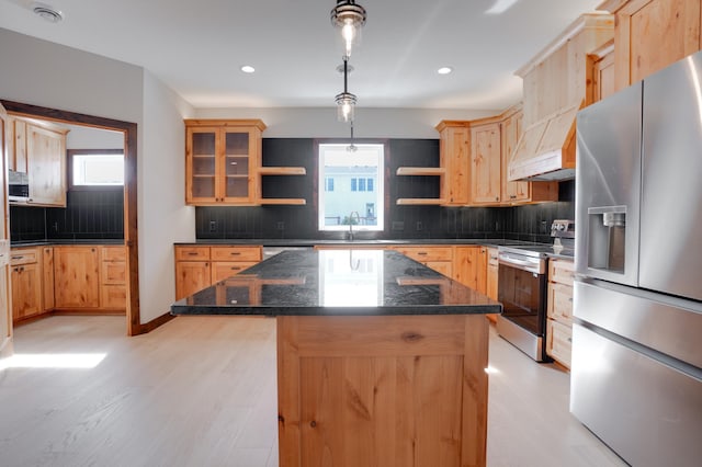 kitchen featuring plenty of natural light, a sink, open shelves, and appliances with stainless steel finishes