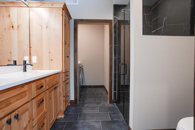 full bathroom with visible vents, toilet, tile patterned floors, vanity, and a stall shower