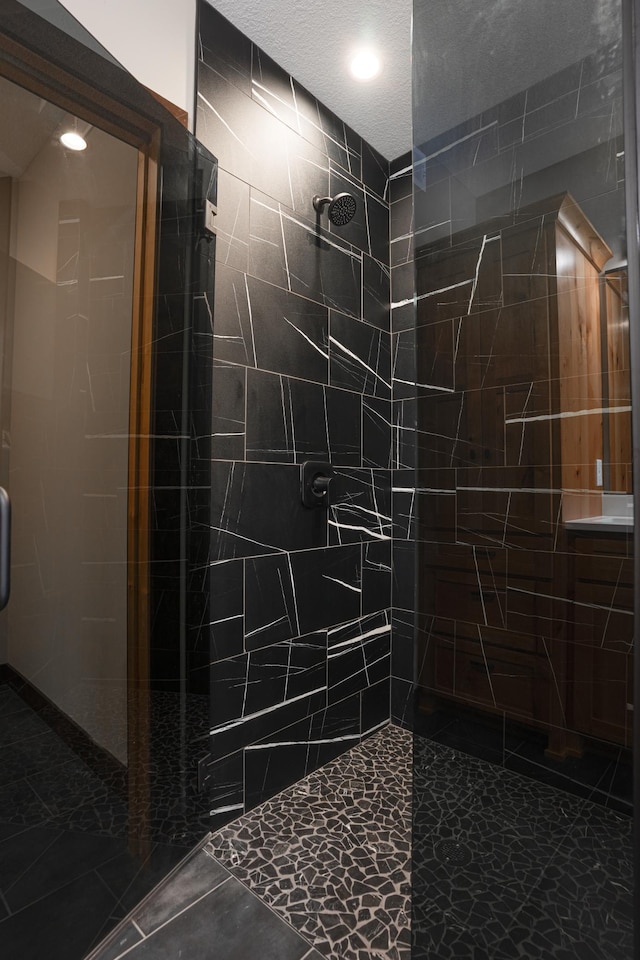 bathroom featuring a shower stall