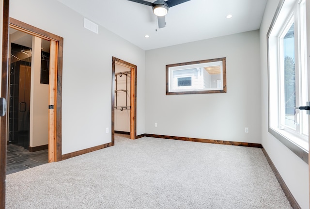 unfurnished bedroom with baseboards, visible vents, carpet floors, and recessed lighting