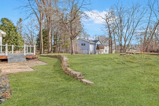view of yard featuring a wooden deck