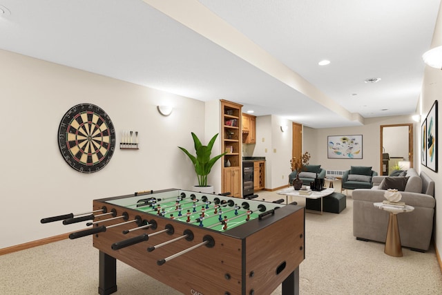game room with wine cooler, baseboards, recessed lighting, and light colored carpet
