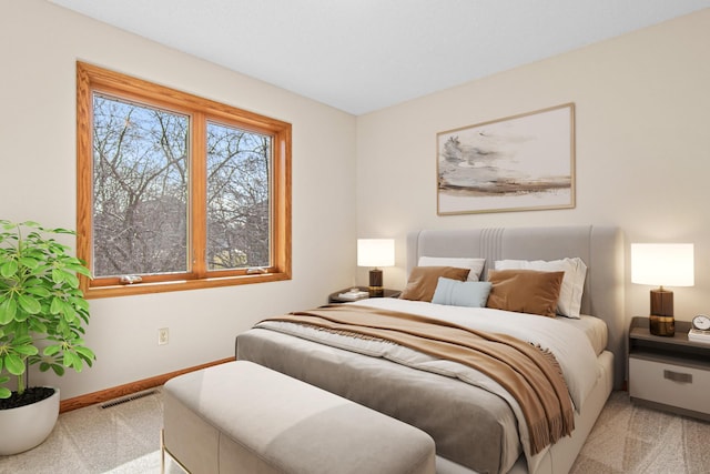 carpeted bedroom featuring visible vents and baseboards