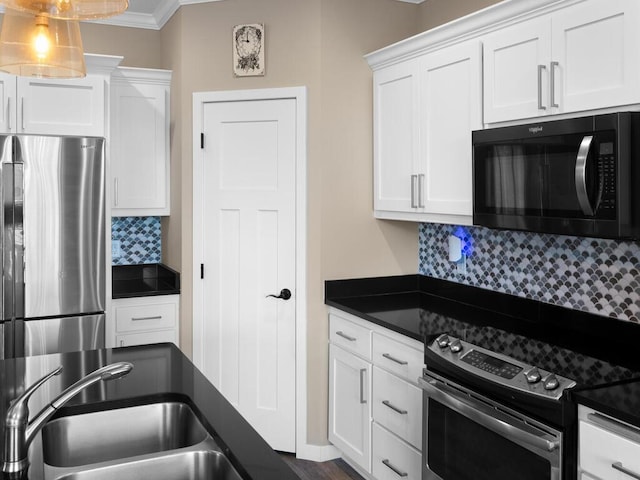 kitchen featuring sink, stainless steel appliances, decorative backsplash, white cabinets, and ornamental molding