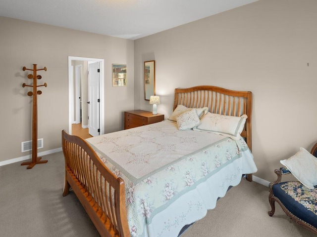 bedroom featuring light colored carpet