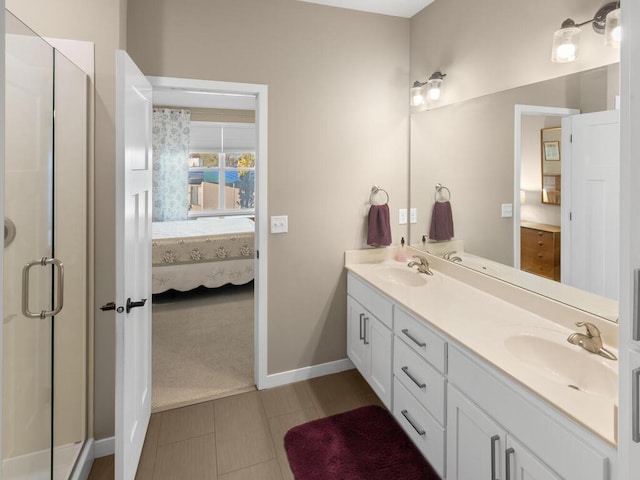 bathroom with vanity and a shower with shower door