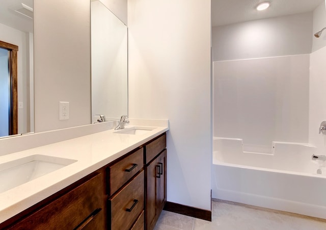 bathroom with tile patterned floors, vanity, and bathtub / shower combination