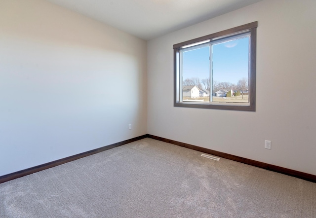 unfurnished room featuring carpet floors