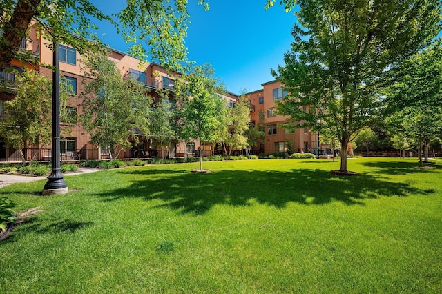 view of home's community featuring a lawn