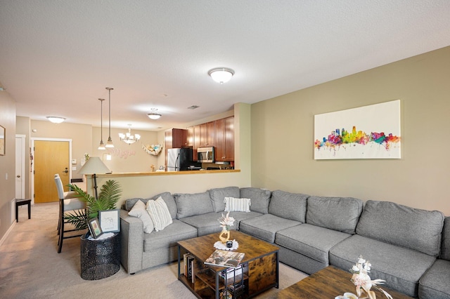 carpeted living room featuring an inviting chandelier