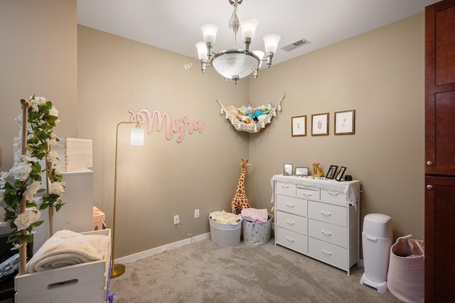 carpeted bedroom featuring a chandelier