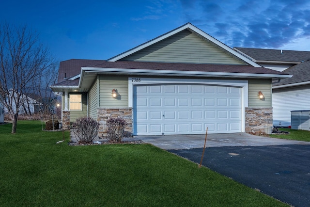 property exterior at dusk with a yard and a garage