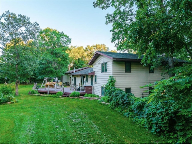 42150 County Road 1, Rice, MN 56367 - rear view of house with a wooden deck and a yard