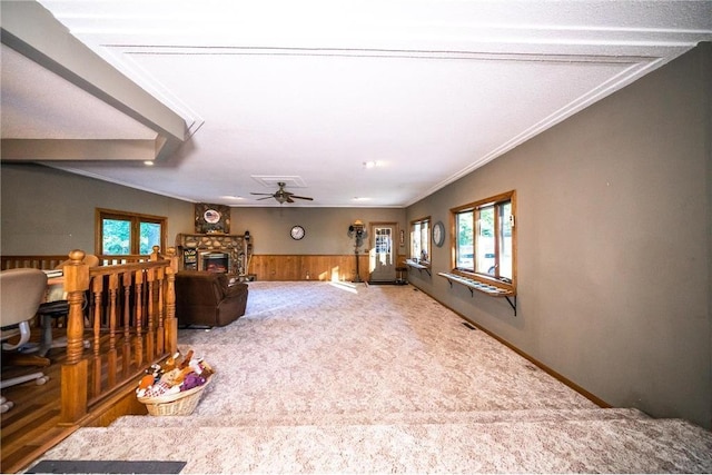 42150 County Road 1, Rice, MN 56367 - living area with a ceiling fan, plenty of natural light, carpet flooring, a wainscoted wall, and wood walls