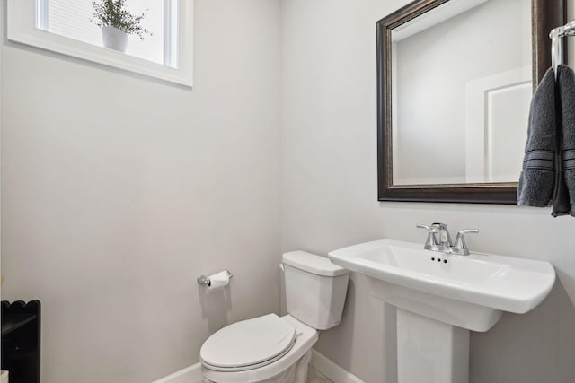 bathroom featuring toilet and sink