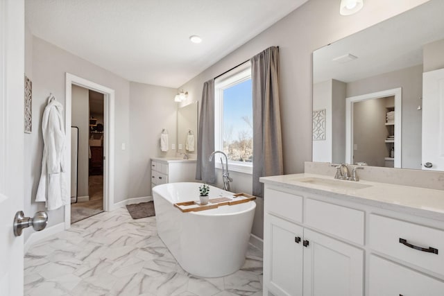 bathroom featuring a bathtub and vanity