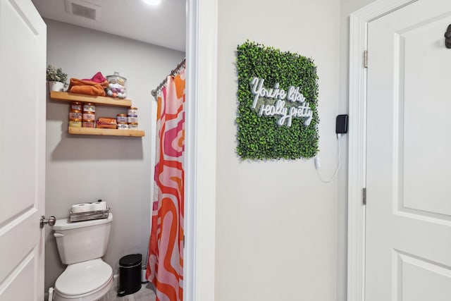 bathroom featuring toilet